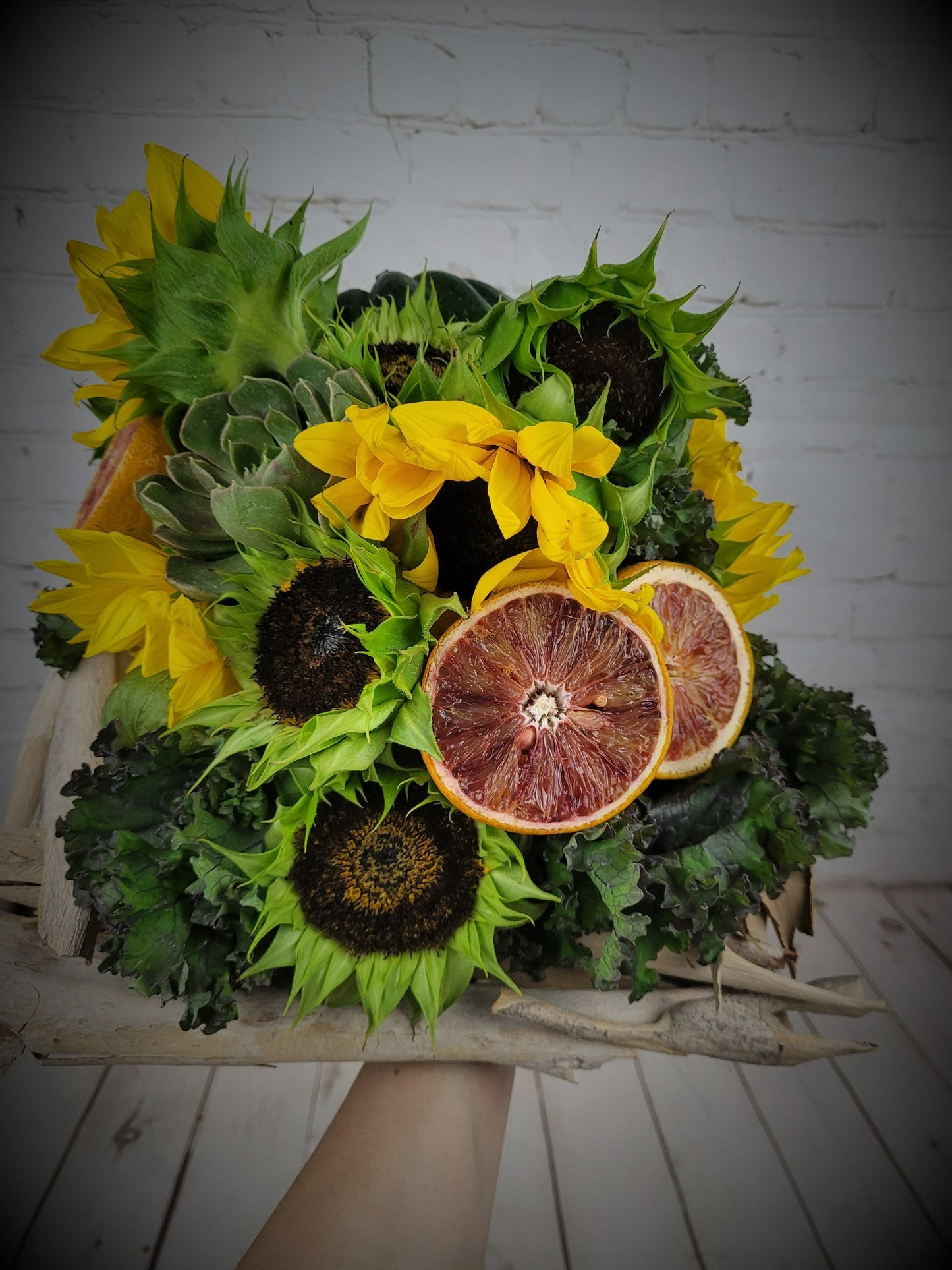 Sunflowers and fruits in a bouquet