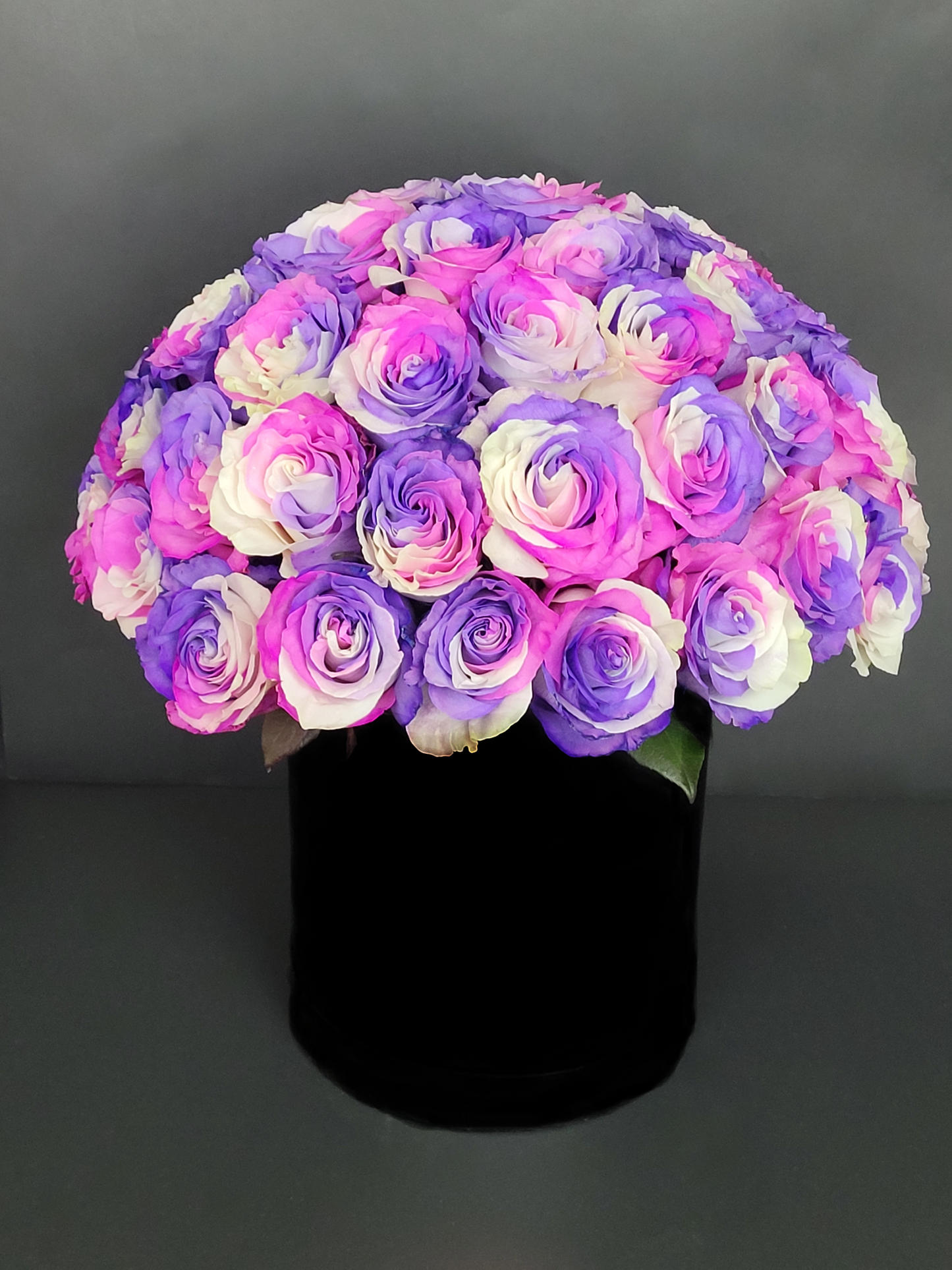Dyed roses in black box