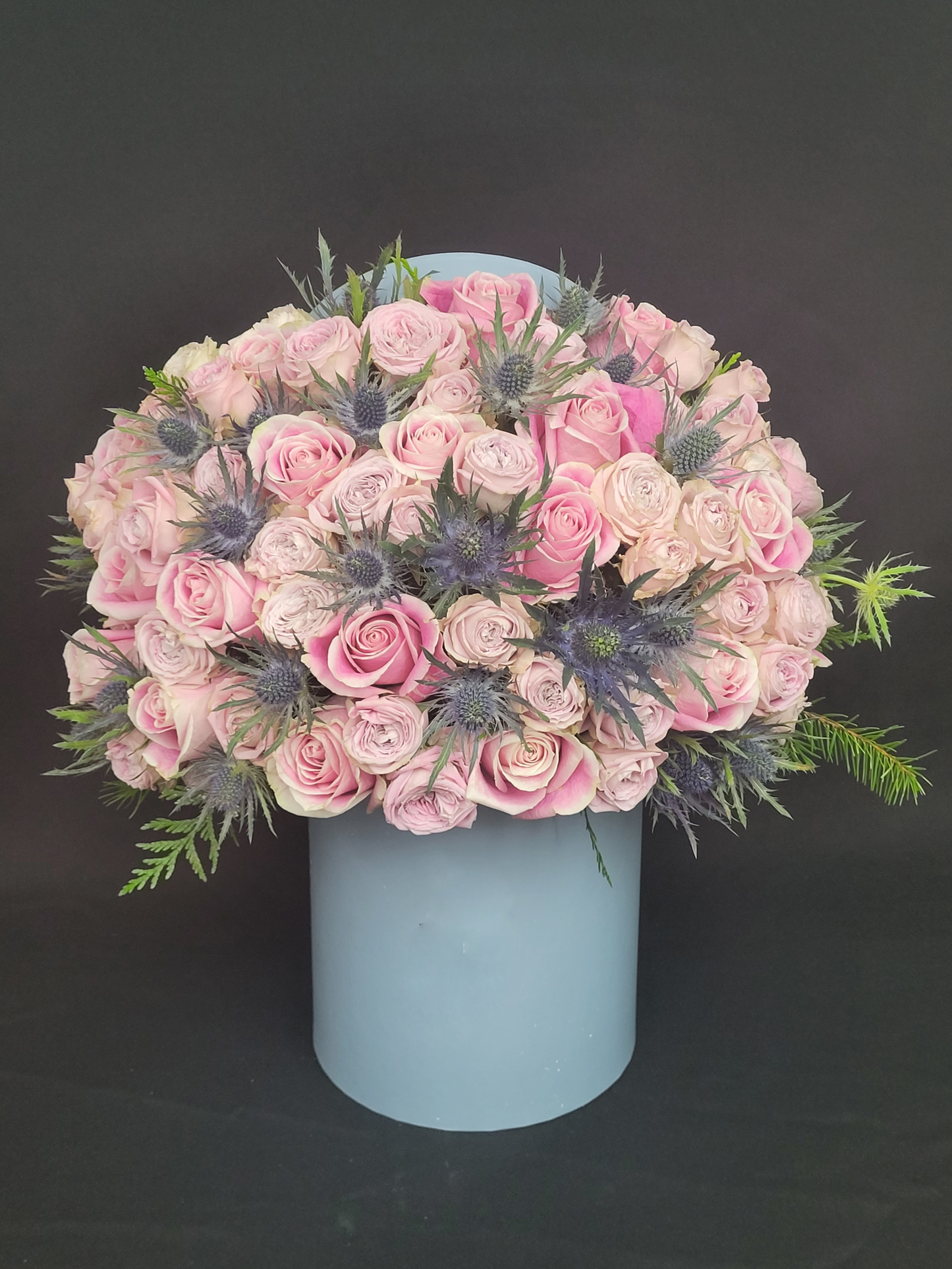 Pink roses in blue box