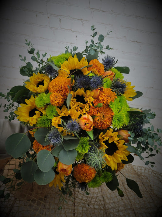 Orange, yellow, green and blue seasonal bouquet