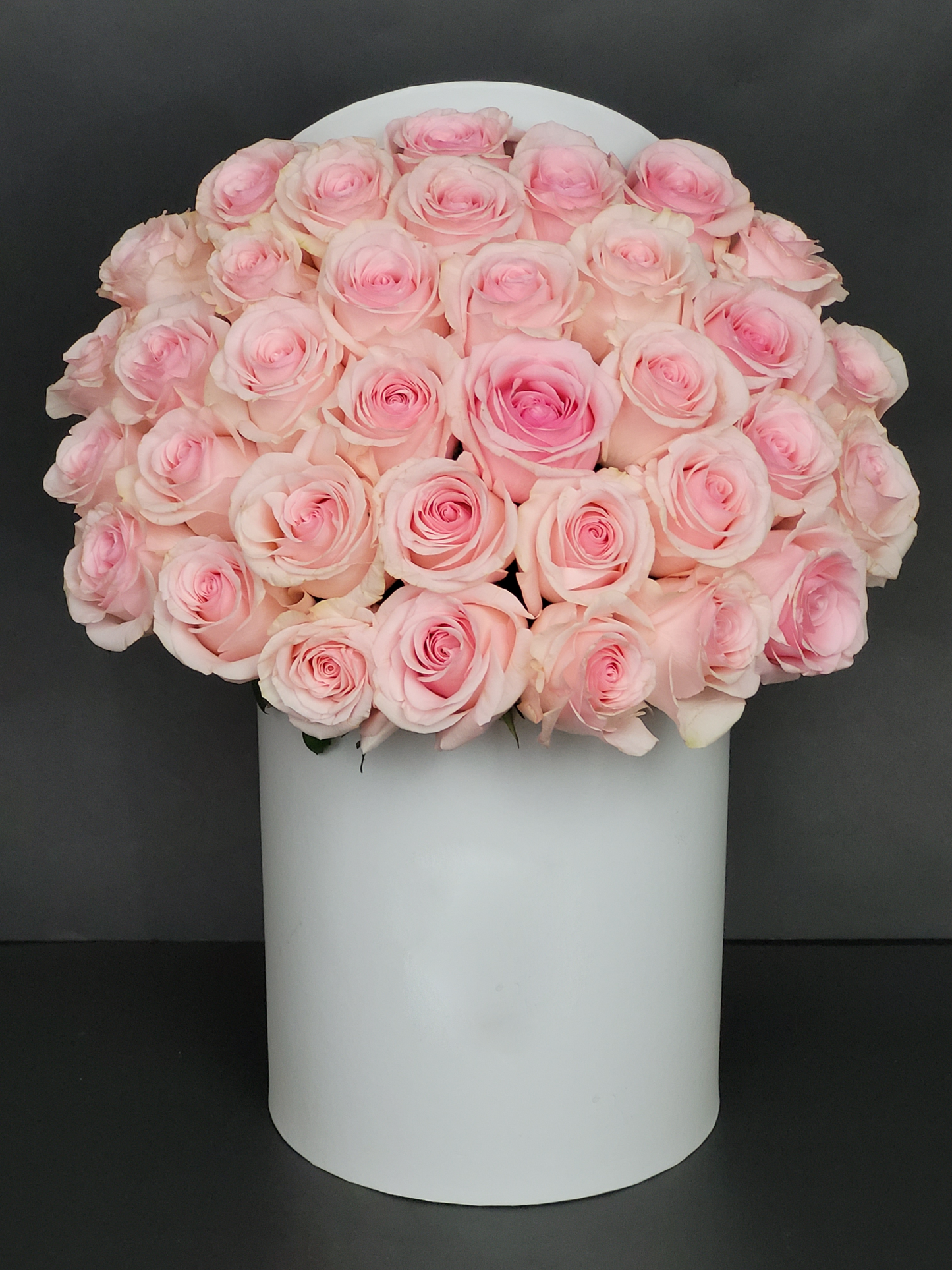 pink roses in white box