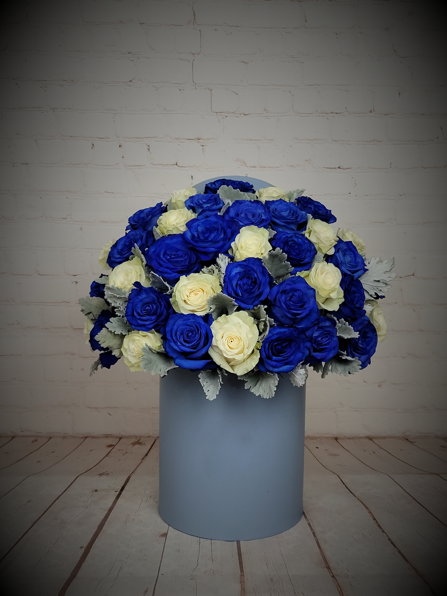 Blue and white roses in a blue box