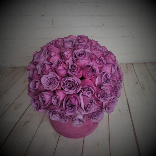 Purple roses in box